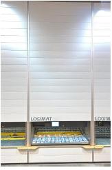 La tour de stockage est comparable  une armoire compartimente surdimensionne comptant deux ranges de plateaux, une  l'avant et une  l'arrire